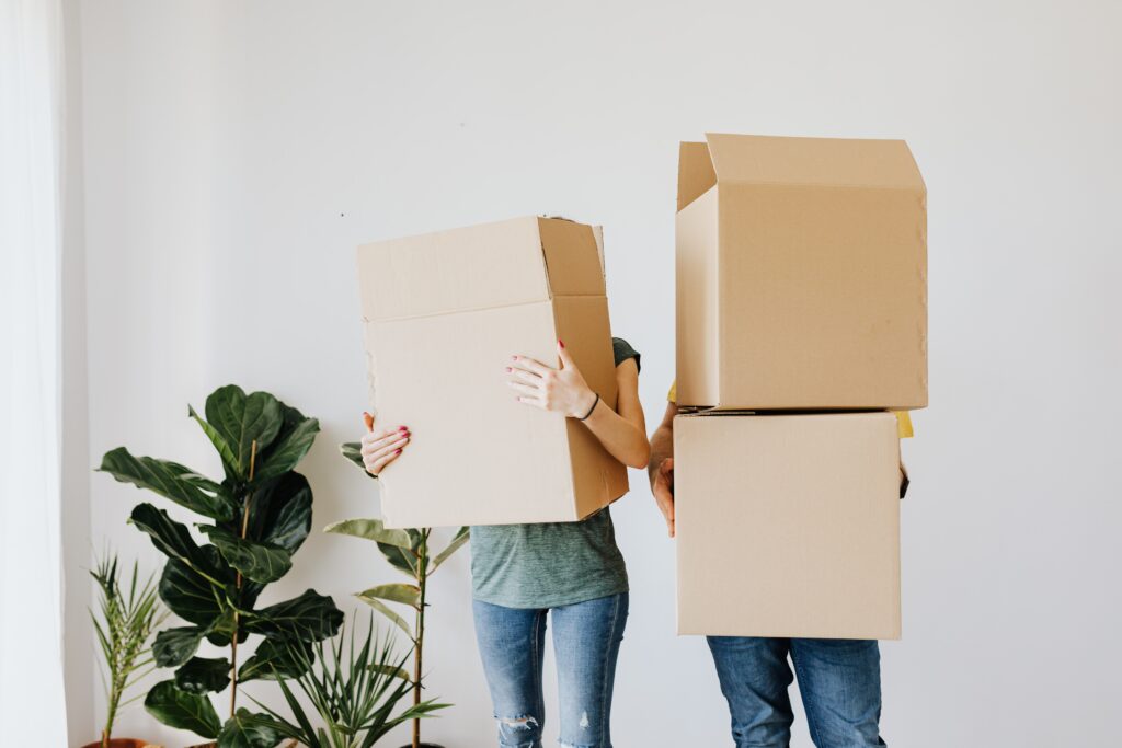 2 people with moving boxes
